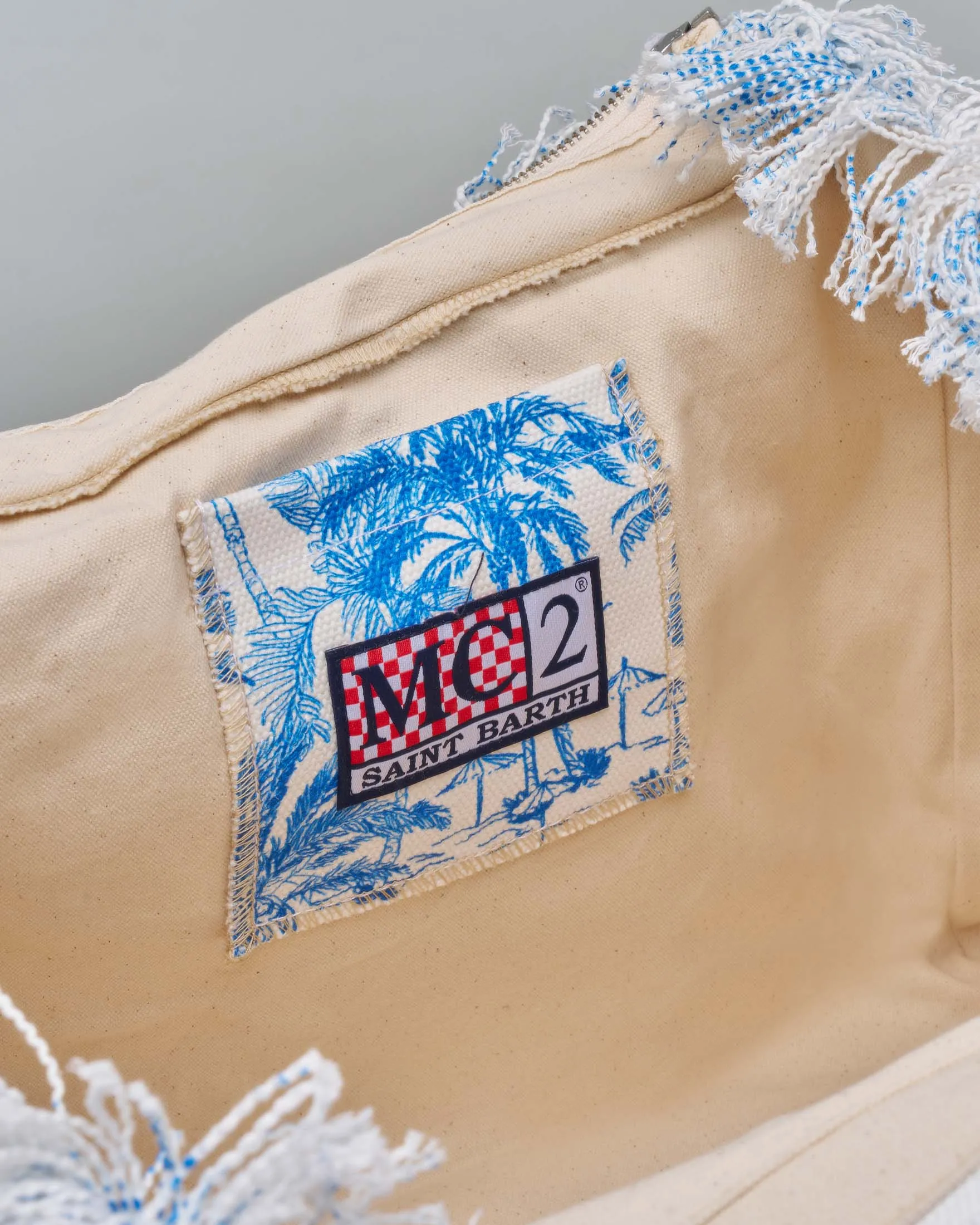 Borsa in canvas di cotone bianca a fantasia Saint beanch blu con scritta logo e manici blu